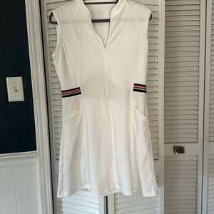 Cute tennis/golf dress with shorts that have pockets! Excellent condition size